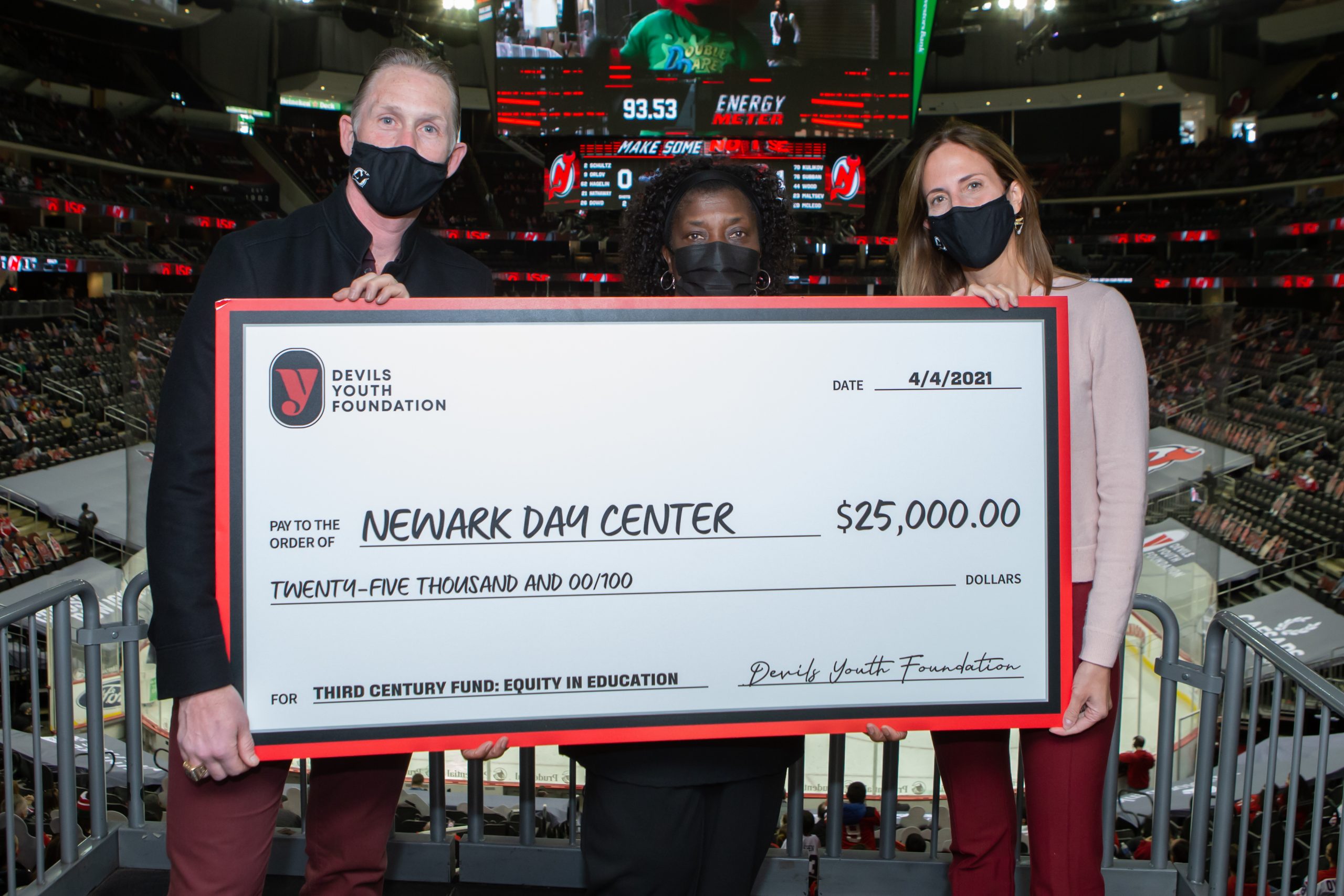 The Devils Youth Foundation donate $25,000 to the Newark Day Center as part of the night